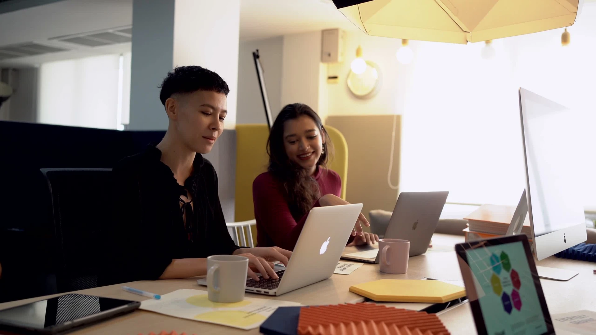 A frame from the opening video of people working together.
